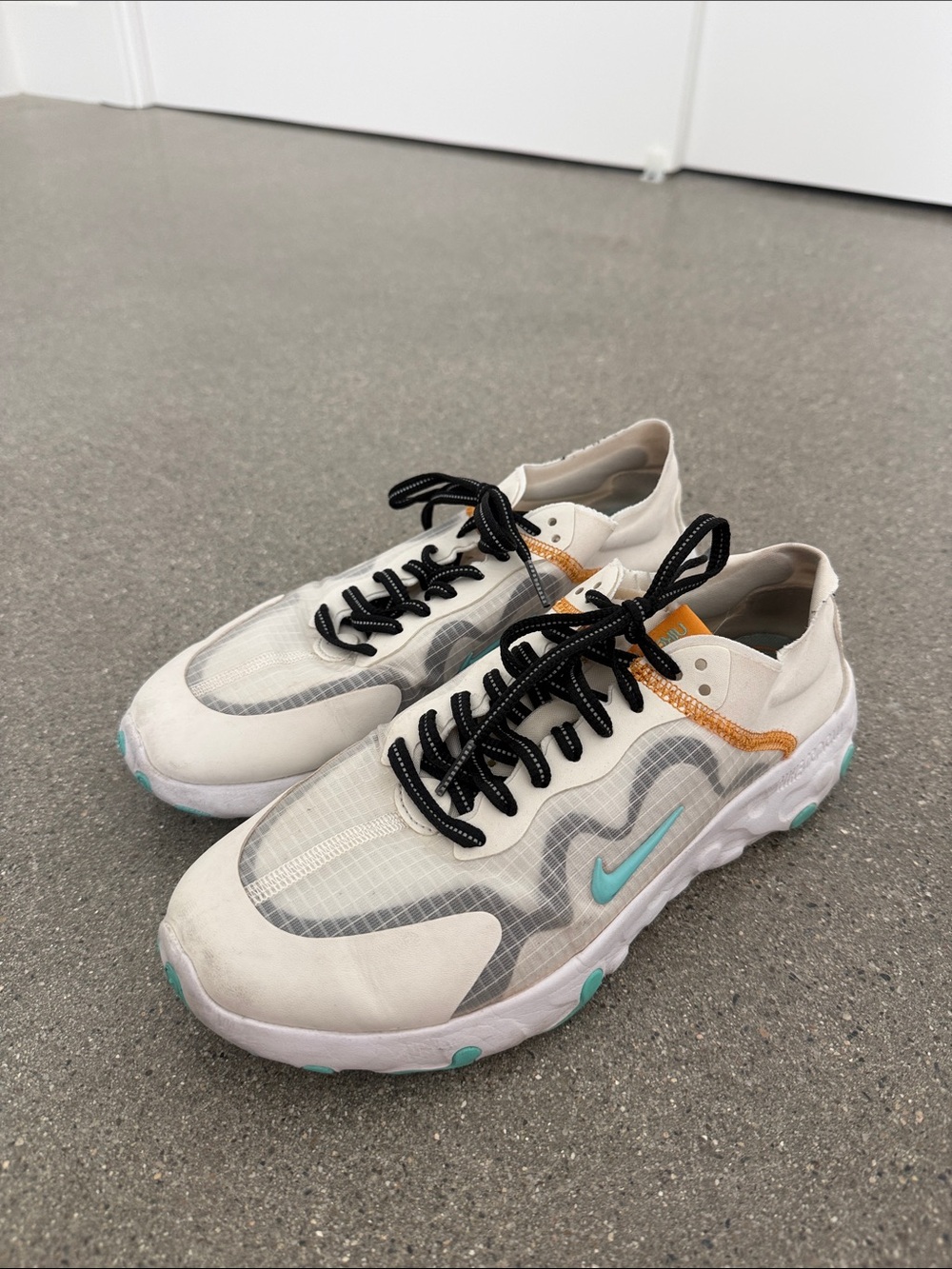 Nike Women’s White with Teal and Black Accent Running Sneakers